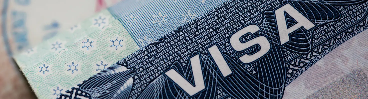 American Family Visa printed on a Latino immigrant's passport American Family Visa printed on a Latino immigrant's passport