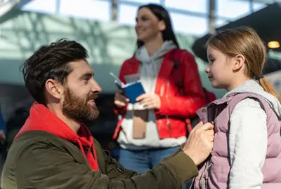 Family preparing to travel after receiving a family visa to the United States