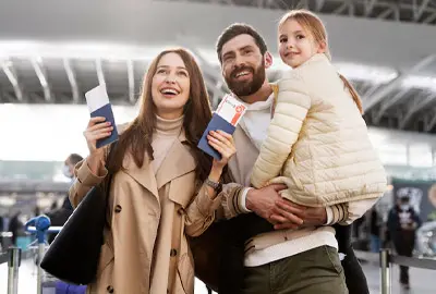 Family waiting for their flight to the United States after receiving a family visa