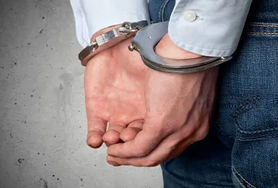 Individual reviewing the immigration arrest process with detention compared to without detention