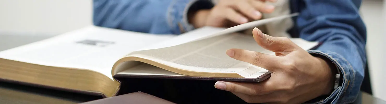 Legal counsel reading about the requirements and benefits of deferred action Legal counsel reading about the requirements and benefits of deferred action